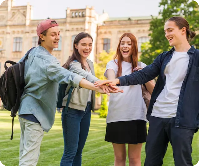 Happy students standing together outdoors